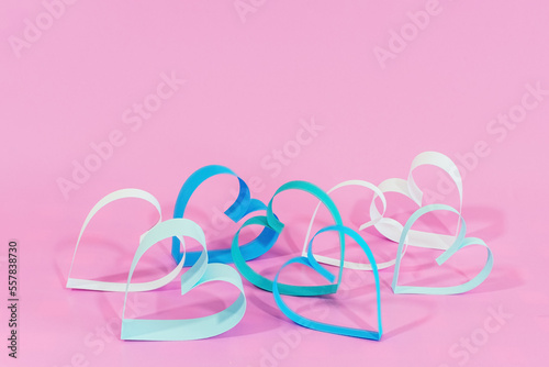 Love hearts on pink background.