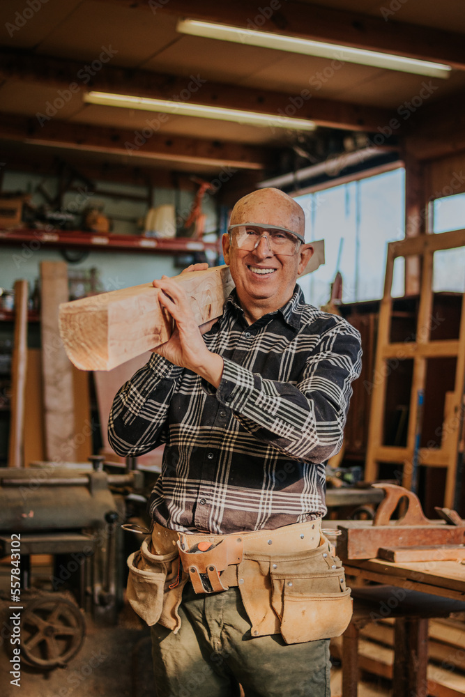 Craftsman working with wood in workshop Craftsman working with wood in workshop