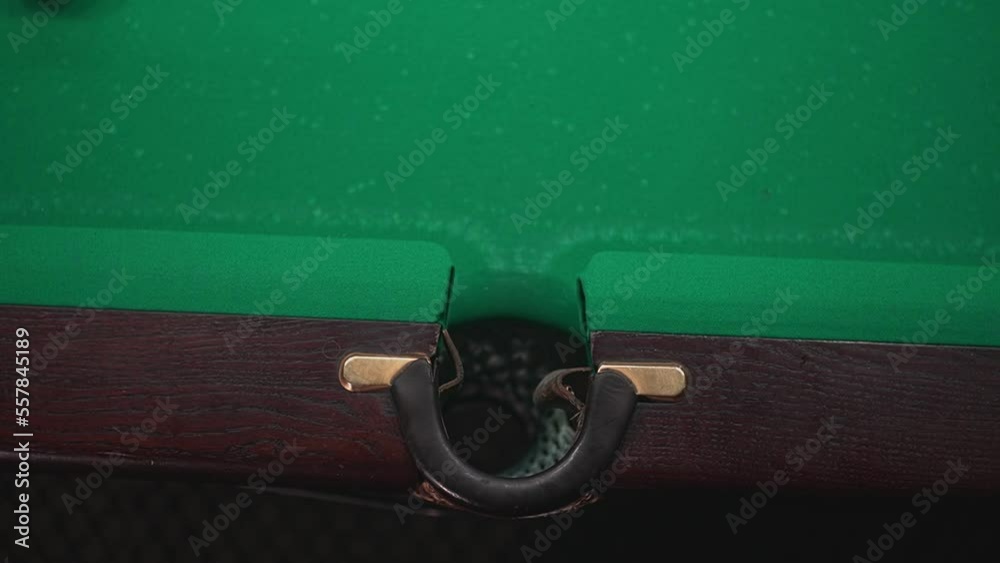 a white billiard ball falls into a pocket. High-quality FullHD video recording. real-time video a white billiard ball falls into a pocket. High-quality FullHD video recording. real-time video