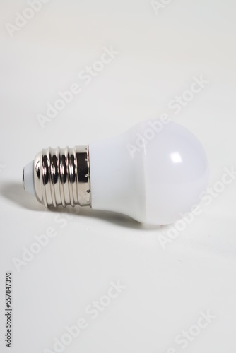 modern electric light bulb next to it on a white background