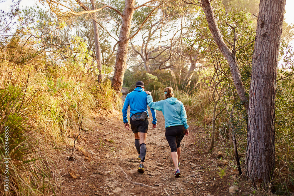 Couple walking together on dirt road in forest Couple walking together on dirt road in forest