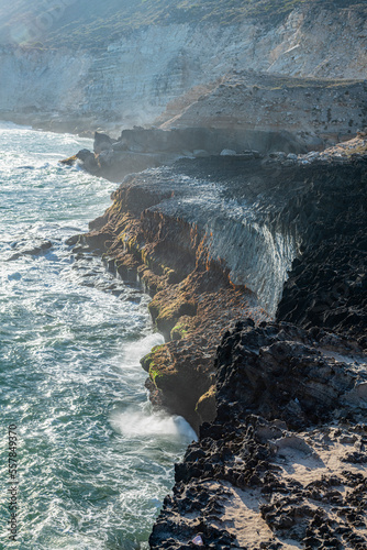 Oman, Dhofar, Salalah, View of rugged coastal cliffs photo