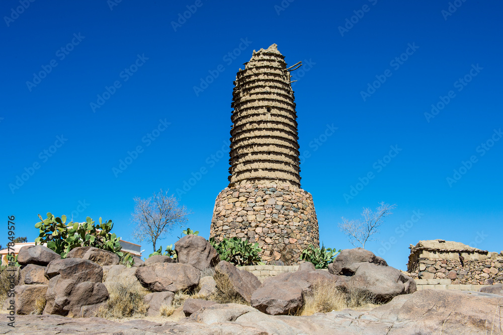 Saudi Arabia, Asir, Abha,Desert tower standing against clear blue sky Saudi Arabia, Asir, Abha,Desert tower standing against clear blue sky