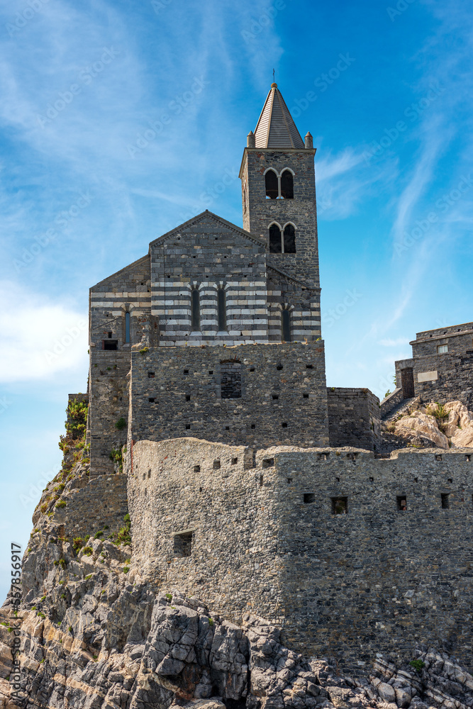 Headland in Portovenere or Porto Venere with the medieval church of San Pietro (St. Peter, 1198), UNESCO world heritage site. La Spezia, Liguria, Italy, Europe.