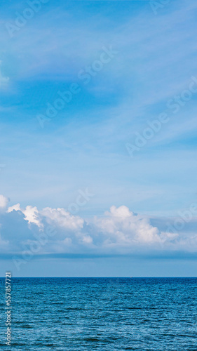BANNER  VERTICAL STORY Atmosphere panorama white cloud clear blue sky horizon line calm empty sea. Concept paradise life. Design relax wallpaper background. More tone format in stock