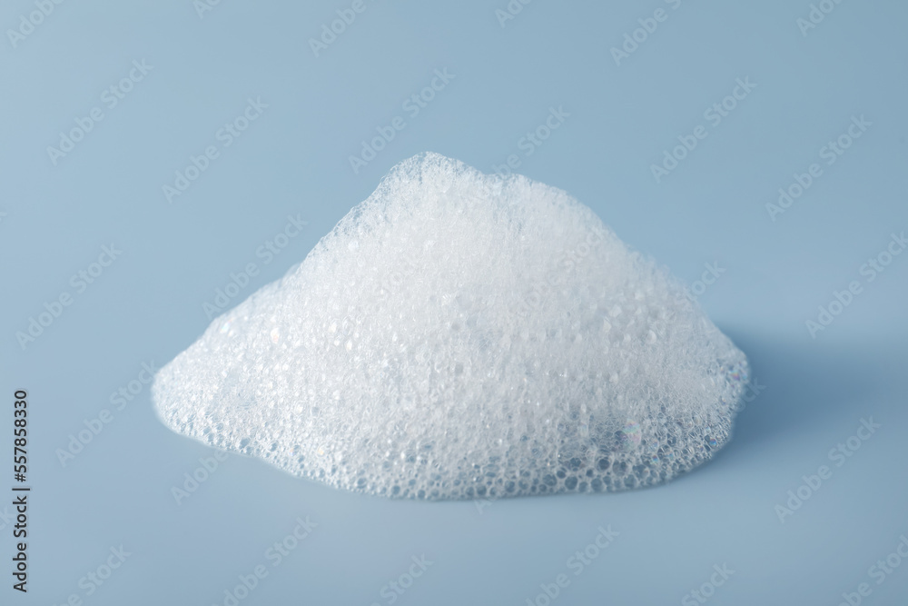 Drop of fluffy bath foam on light blue background Drop of fluffy bath foam on light blue background