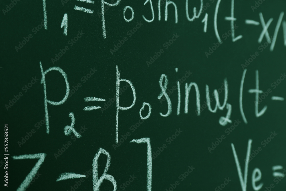 Many different math formulas written on chalkboard, closeup Many different math formulas written on chalkboard, closeup