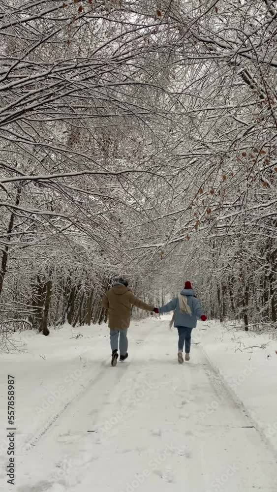 lovely couple having fun in snowed forest lovely couple having fun in snowed forest