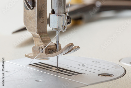 Sewing machine needle with thread and fabric