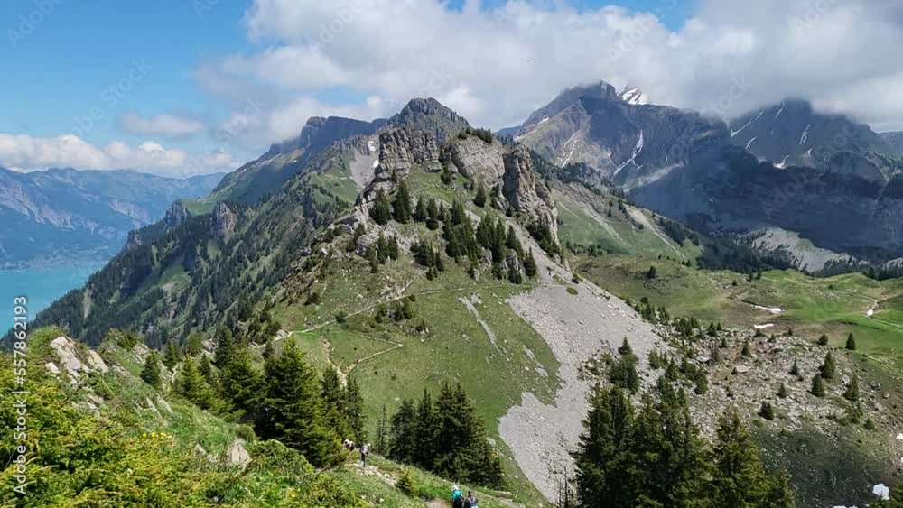 Panoramic view in Daube hiking trail in Schynige Platte during early summer season with view towards mountains and lake. Panoramic view in Daube hiking trail in Schynige Platte during early summer season with view towards mountains and lake.
