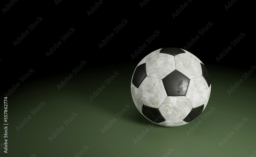 Soccer Ball Isolated on green / Detail of a old black and white soccer ball isolated on green background