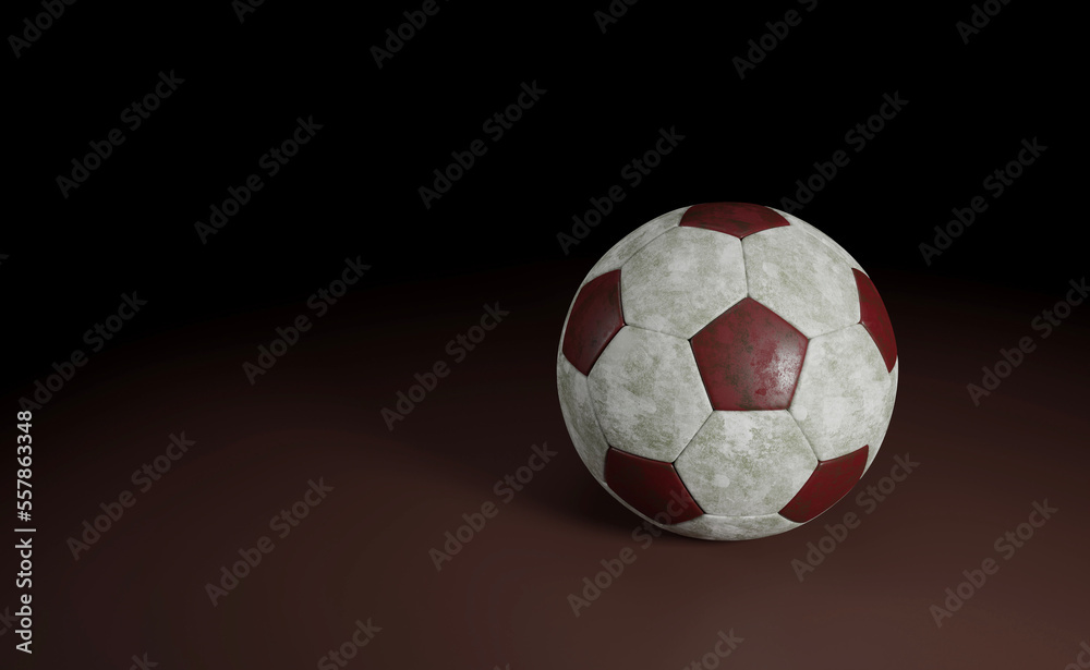 Soccer Ball Isolated on red / Detail of a old black and white soccer ball isolated on red background
