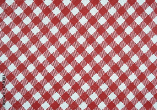 Red white checkered classic pattern cotton fabric background.