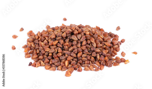 Buckwheat tea isolated on white background. Whole roasted buckwheat grains. Fagopyrum tataricum.