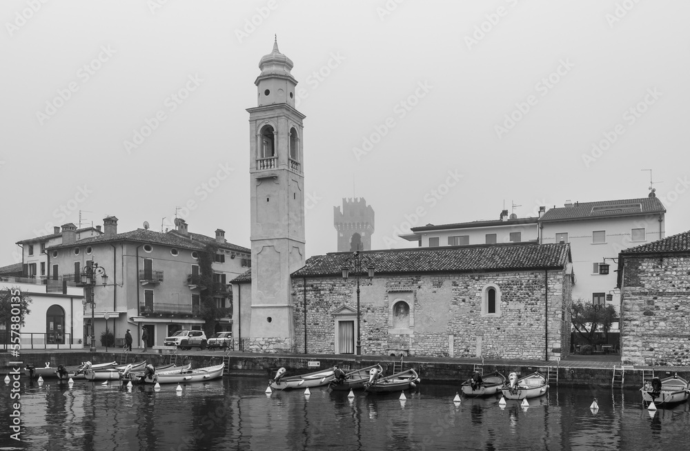 Port of Lazise on Lake Garda, right the church of San Nicolò, Lazise, Verona province, northern Italy, Europe, january 21, 2022