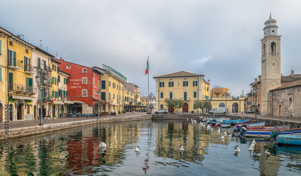 Naklejka premium Port of Lazise on Lake Garda, with the church of San Nicolò, Lazise, Verona province, northern Italy, Europe, january 21, 2022