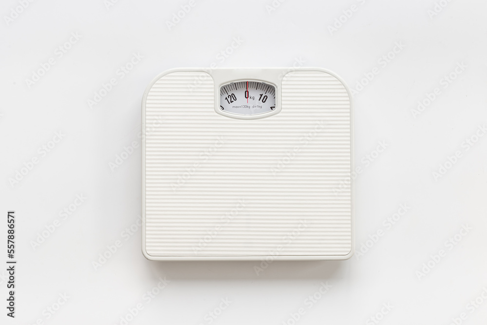 White weight scales on the floor. Weight measurement and loss concept White weight scales on the floor. Weight measurement and loss concept