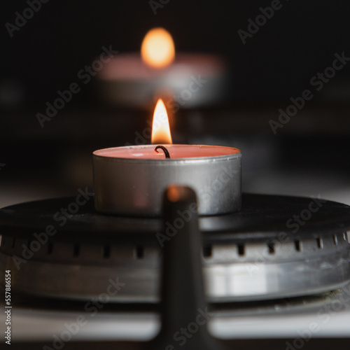 Burning candles on a kitchen burner