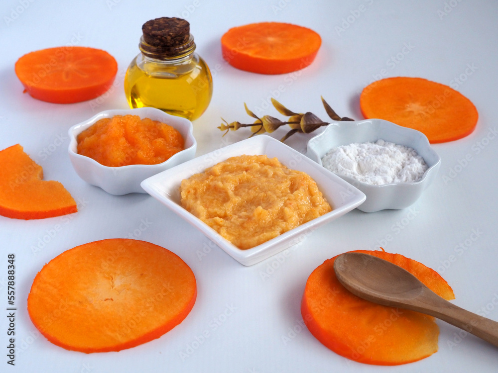 Homemade cosmetic mask of persimmon and rice flour with almond oil Homemade cosmetic mask of persimmon and rice flour with almond oil