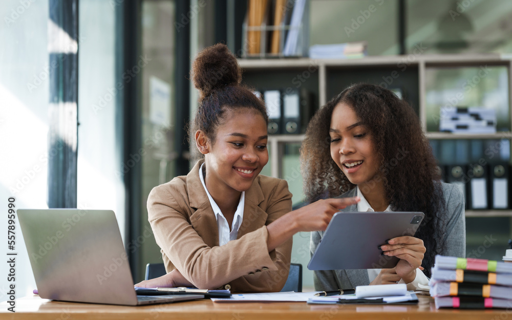 An African American businesswoman participates in a staff meeting and working together at workplace.