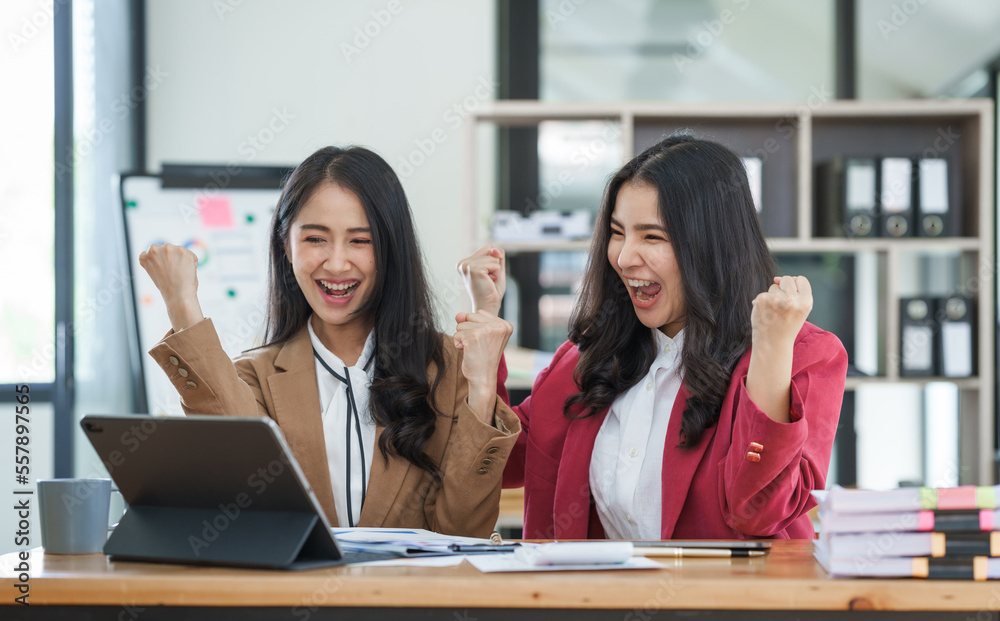 Asian company employees and colleagues work together in the office. by talking and giving advice
