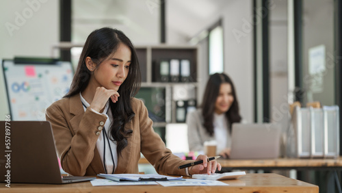 Asian company employees and colleagues work together in the office. by talking and giving advice to each other