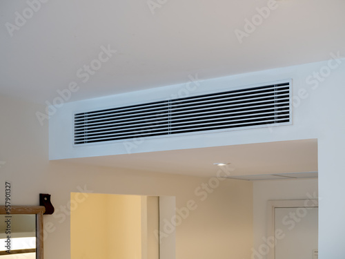 Bild auf Leinwand Air conditioning wall mounted ventilation system on ceiling in the white hotel room