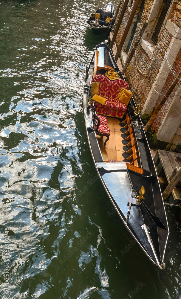 High angle view of a gondola moored in a Venetian canal, Venice, Italy
