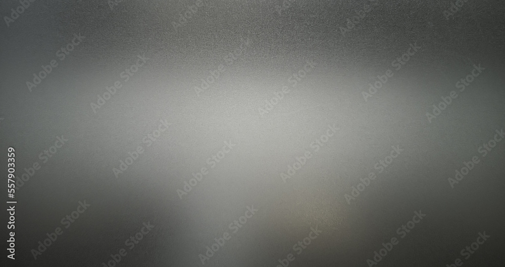 Frosted gray glass texture. Dark shadow from behind.