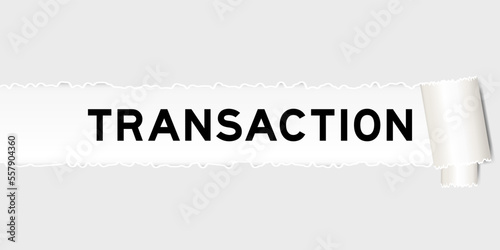 Ripped gray paper background that have word transaction under torn part
