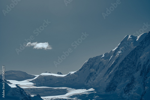 landscape of snowy mountains and blue sky with copy space for text © Siriporn