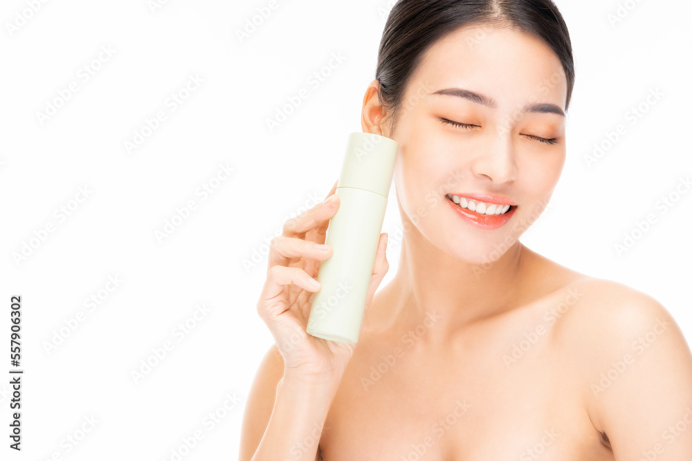 Beauty asian woman model hold cosmetic bottle with smiling Beautiful Asian female has beauty facial skin Beauty face body portrait isolated on white background Happy girl close eyes with smile face Beauty asian woman model hold cosmetic bottle with smiling Beautiful Asian female has beauty facial skin Beauty face body portrait isolated on white background Happy girl close eyes with smile face