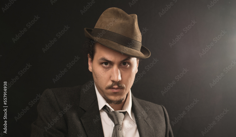 Old school mobster in a retro hat. Old school mobster in a retro hat.