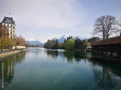 lake in the village and alps in the background