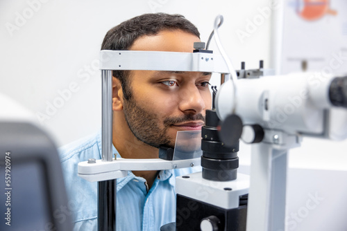 Young man having an examination in a ophtalmological clinic photo