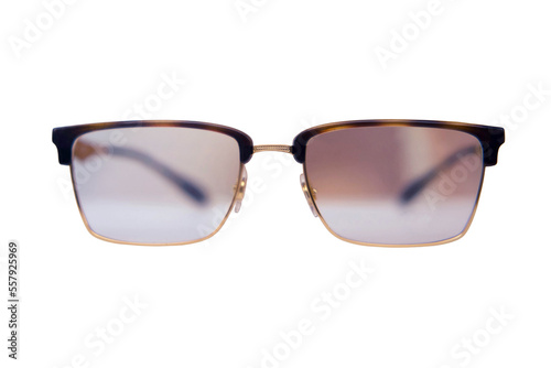 Square glasses with brown frames close up on a store shelf, isolated on a white background