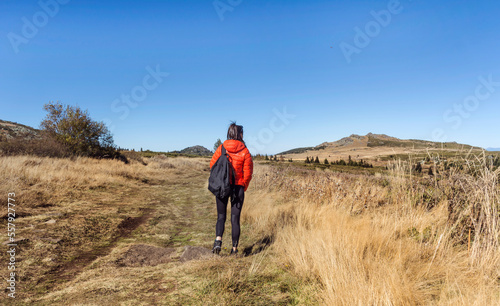 Woman walking in the autumn mountain . Vitosha mountain ,Bulgaria