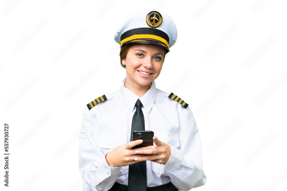 Airplane pilot woman over isolated chroma key background sending a message with the mobile