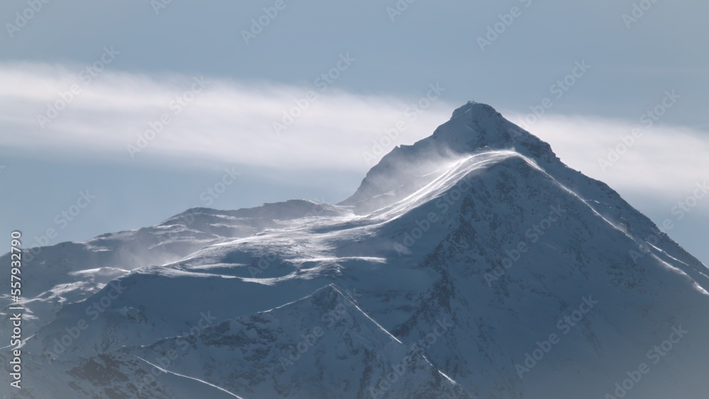 foehn storm on the mountains at a sunny winter day in austria the hohe tauern national park
