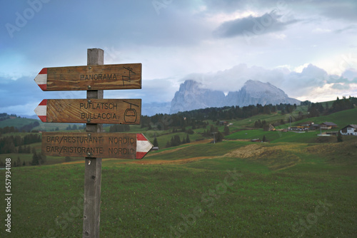 Wonderful view of the Alpe di Siusi with a sign in the foreground in the dolomites mountains, South Tyrol, Italy