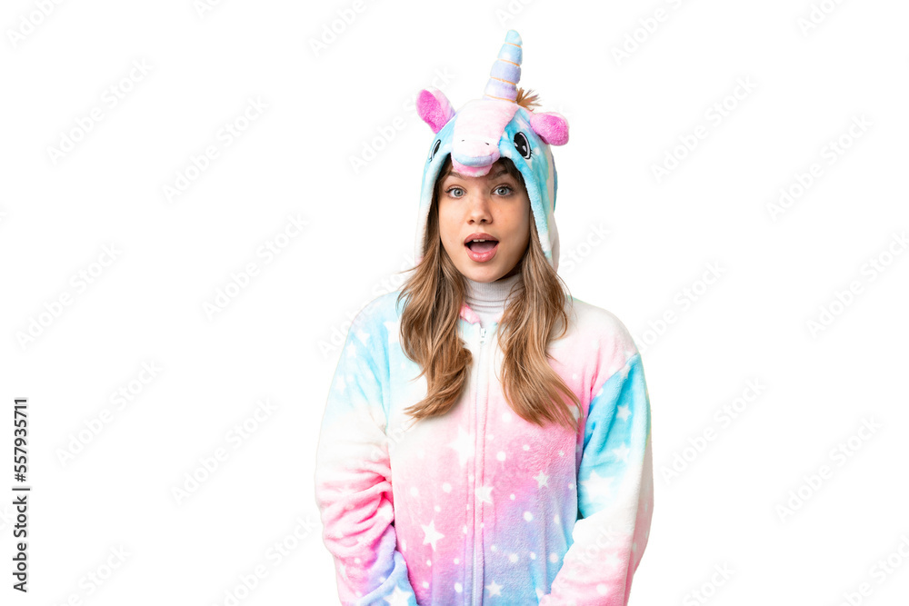 Young girl with unicorn pajamas over isolated chroma key background with surprise facial expression Young girl with unicorn pajamas over isolated chroma key background with surprise facial expression