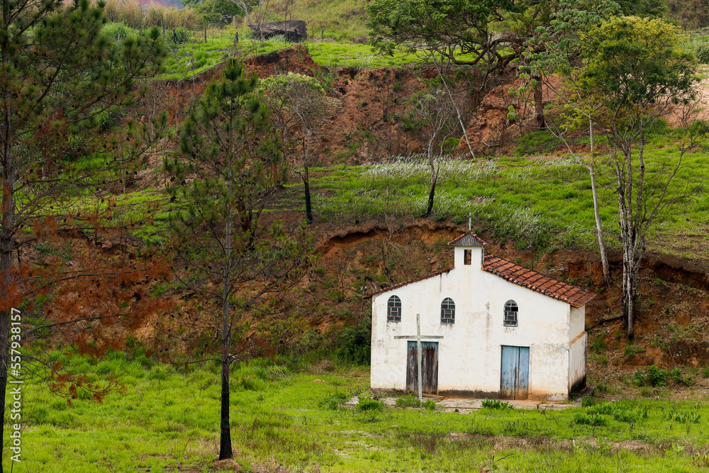 Small white farm chapel flanked by pine trees on countryside of Sao Paulo state, Brazil Small white farm chapel flanked by pine trees on countryside of Sao Paulo state, Brazil