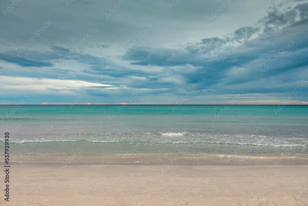 San Teodoro sand beach with turquoise sea water in Sadinia Italy, clouds in the sky during summer San Teodoro sand beach with turquoise sea water in Sadinia Italy, clouds in the sky during summer