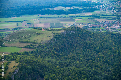 View from a motor glider on one of the holy mountains of Franconia in Franconian Switzerland/Germany, the Walberla with the Walburgis chapel © fotografci
