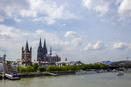 Cityscape of Cologne with Hohenzollern bridge, cathedral, Saint Martin church and Rin river in Germany