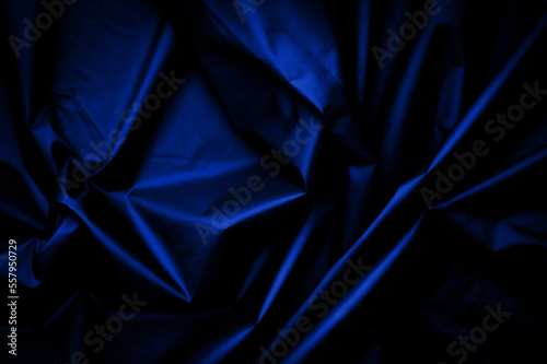 blue nylon texture. minimalist and elegant crumple textile. simple dark background