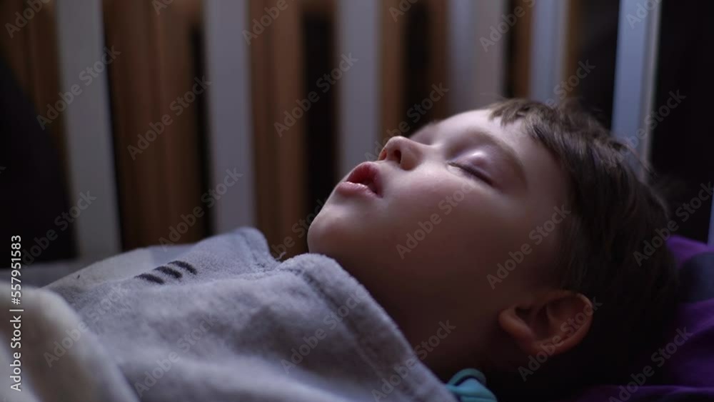 Closeup side view of 3yearold kid boy sleeping with open mouth