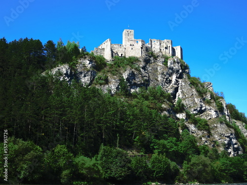 castle of strecno on the hill surounded by green forest in summer in slovakia photo