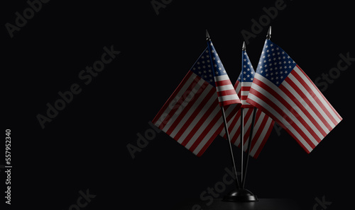 Small national flags of the USA on a black background photo