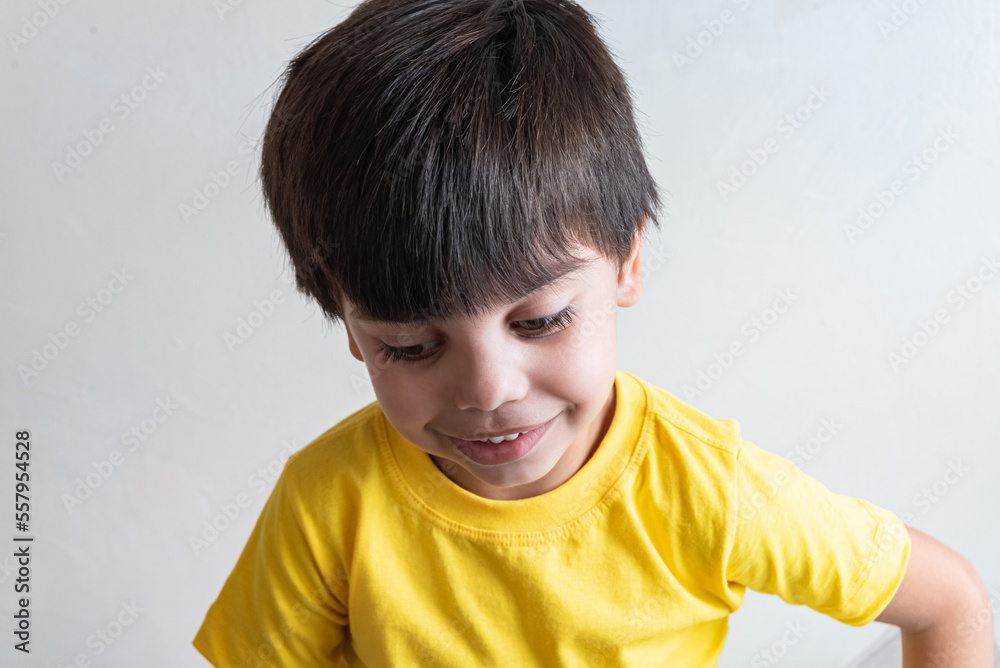 Cute and happy boy with yellow t-shirt Cute and happy boy with yellow t-shirt